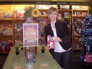 karin-adams-lights-curtains-cows-book-launch-karin-with-display karin-adams-lights-curtains-cows-book-launch-karin-with-display