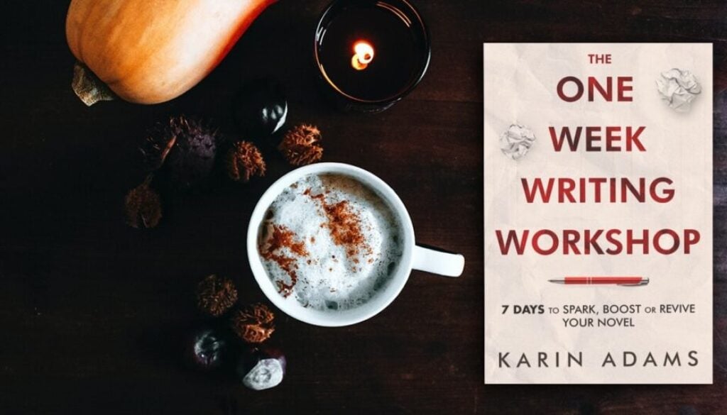 The One Week Writing Workshop book with a cup of hot cocoa beside a candle and a decorative gourd.
