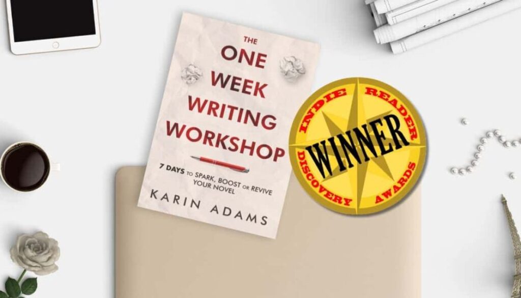 an image of The One Week Writing Workshop book on a desk with whimsical objects and alongside a sticker declaring it an IndieReader Discovery Awards winner