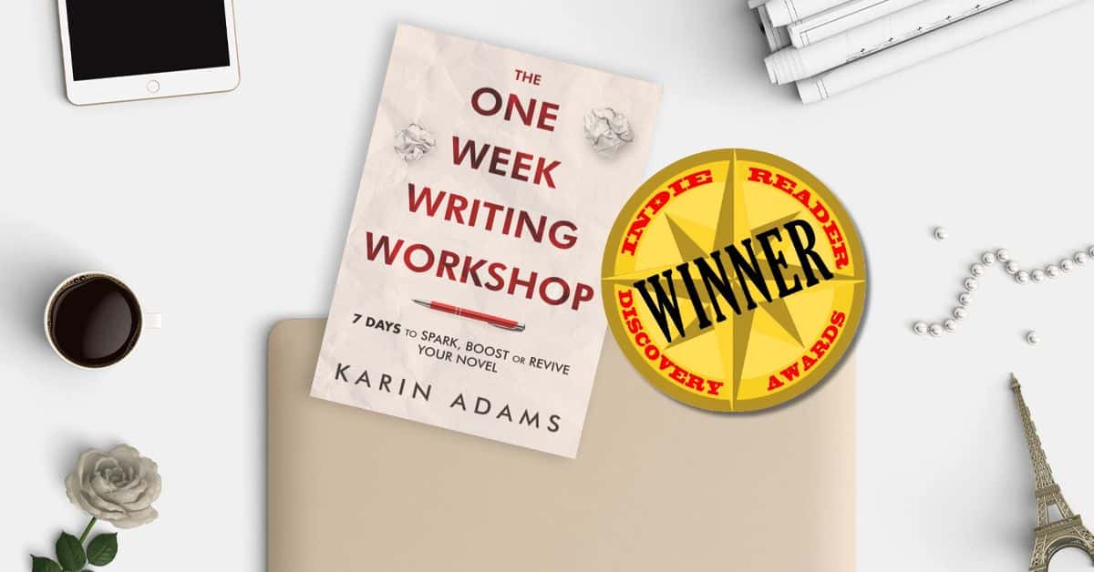 an image of The One Week Writing Workshop book on a desk with whimsical objects and alongside a sticker declaring it an IndieReader Discovery Awards winner